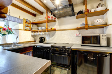 Kitchen with beamed ceiling