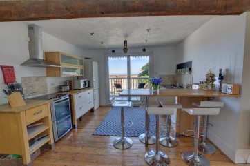 The kitchen benefits from French doors which lead to a larger balcony ideal for BBQs or leisurely breakfasts al fresco.