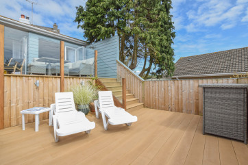 Decking area with sun loungers, great for a BBQ and relaxing in the evening