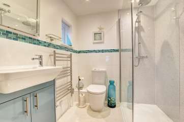 Bathroom 2: Bath, thermostatic dual shower over, wash basin, WC