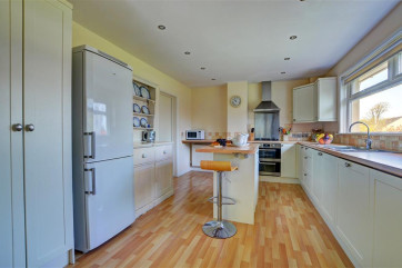 High quality fully fitted kitchen with a picture window and views over the garden