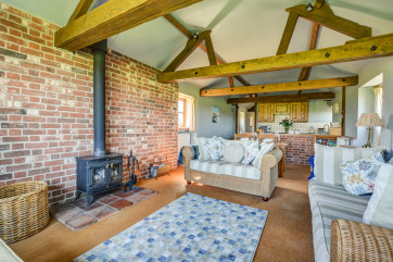 The sitting room has a traditional woodburner for those cosy evenings