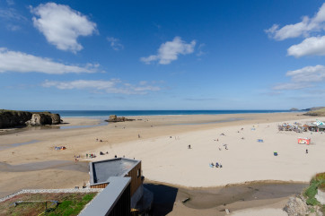 View across miles of golden sand out to sea