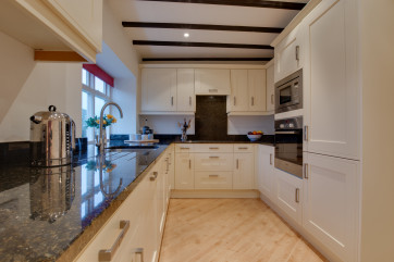 Kitchen with beamed ceiling