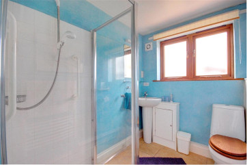A spacious shower room will enable easy bathing for anyones who enters. 
