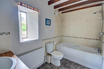 Light and airy bathroom at West Close Cottage
