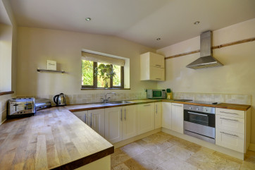 The kitchen has a good range of modern units and appliances and a beautiful tiled floor, which extends through the entire property
