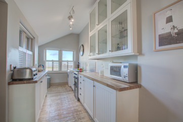 Galley style kitchen with lots of worktop and storage