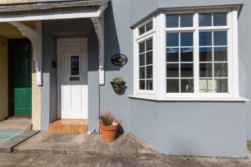 A view of Woodbine Cottage front door in coastal village of Saundersfoot.