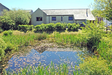 Pond in the garden to the rear of the property and 100 acres