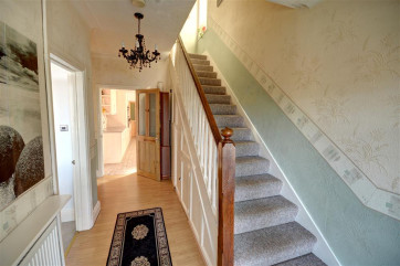 Spacious Hallway with stairs leading to the upper floors.