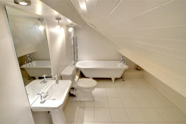 En-suite bathroom to the top bedroom which includes a roll top bath.