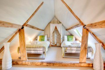 Bedroom two is on a mezzanine with twin beds