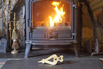 Cosy farmhouse holiday - large lounge with a wood-burner in the inglenook