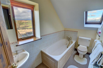 Bathroom has a bath and some great views!