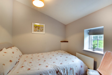 Large single bed in the second bedroom.