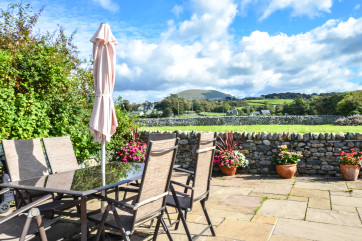 The patio are has lovely views over village and fields to the mountains