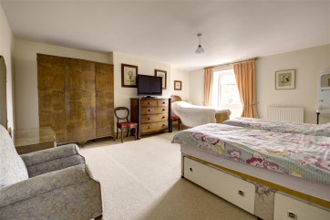 Large bedroom with 3 single beds