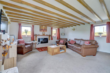 There is comfortable seating and modrn electric fire.