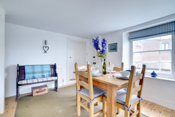 The separate dining room, also has lovely sea views and sounds of the nearby waterfall