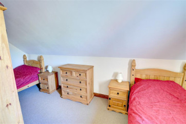 Twin bedroom offers comfortable space for both single beds.