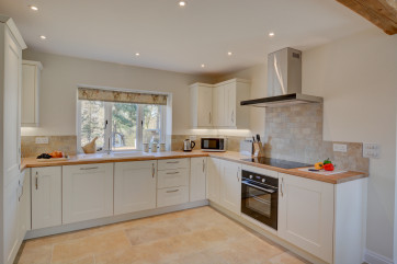 Kitchen with cooker and view of garden