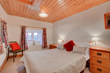 Spacious master bedroom with triple aspect windows