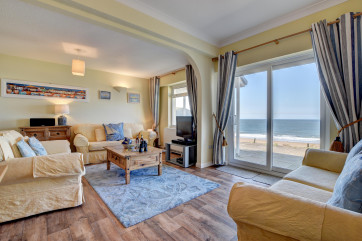 Comfortable sofas in the sitting room and large TV