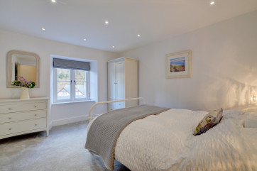 The stylish and spacious double bedroom overlooks the river 