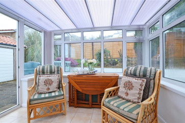 The conservatory adds extra space to relax and has access to the patio and garden
