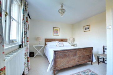 Second bed room with double bed and garden views