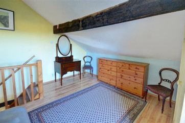 The spacious dressing area of the bedroom.