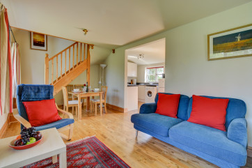 The sitting room has a dining area just outside the kitchen.