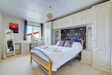 The master bedroom is spacious and has ample wardrobe space for your belongings