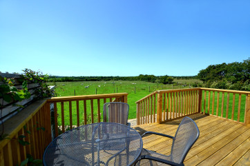 Rear decked area of the property, with views of the countryside