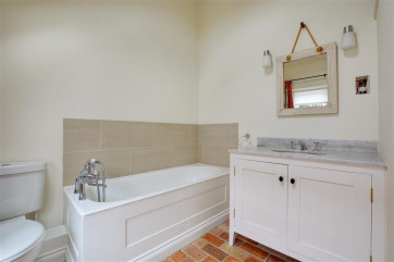 Bathroom with bath, washbasin and wc
