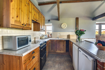 Traditional kitchen with most major appliances and well equipped with the added bonus of an utility room
