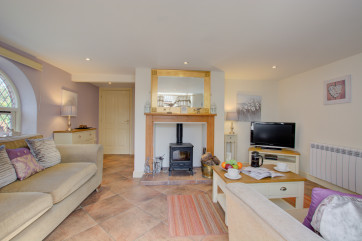 Sitting Room with comfortable seating and woodburner