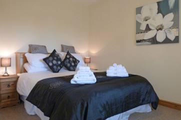 Bedroom 3: King size bed with en suite, walk in wardrobe & balcony
