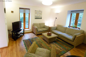 Lounge with stove at this cosy self catering, Brecon Beacon