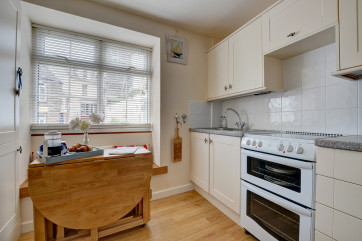Compact kitchen with dining table
