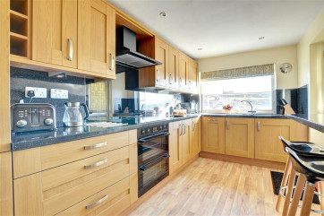 Well-equipped spacious Kitchen with a fantastic picture window framing a view of the whole town.