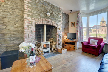 The woodburner makes the sitting room extremely cosy on cooler evenings