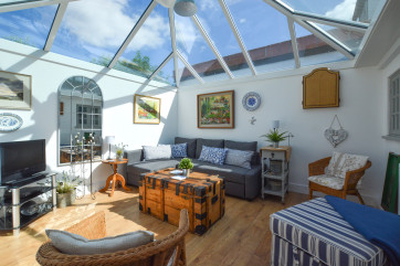 Conservatory with seating and TV