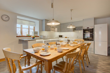 Well equipped kitchen with large table and chairs