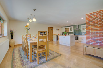 Large wooden table and chairs for dining in comfort.