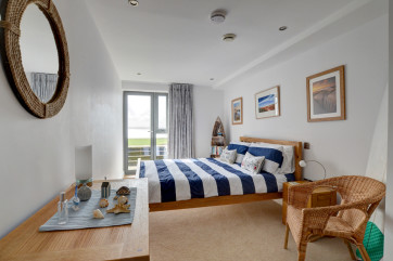 Airy master bedroom with patio door