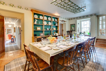 Farmhouse style dining room with four oven AGA giving a warm welcome in any season!