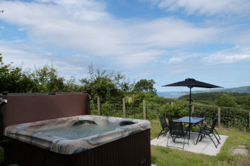 Sea and mountain views from this cottage with private hot tub