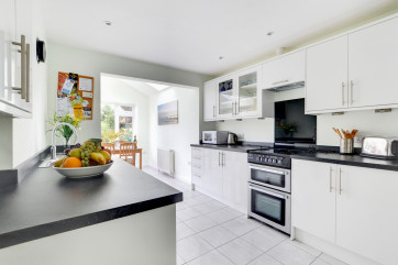 The spacious new kitchen with extended breakfast room opens onto a private, fully enclosed rear garden